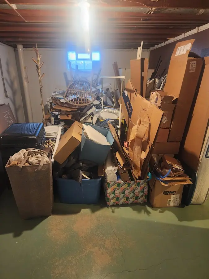 Roll-off dumpster container at job site for 2 Yard Dumpster Rental in Federal Heights